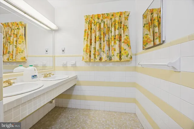 a bathroom with a bathtub and a sink