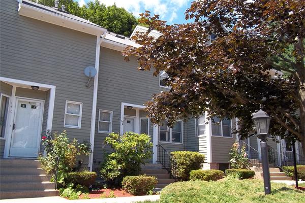 34 Farmland Road, Unit D Lowell, MA 01850 - Photo 1 of 10 a front view of a house with garden