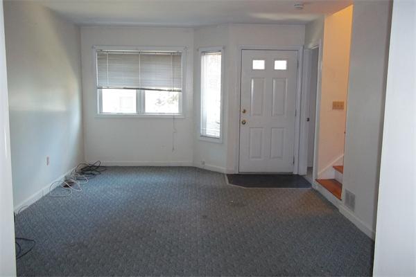 34 Farmland Road, Unit D Lowell, MA 01850 - Photo 4 of 10 an empty room that has a window in it