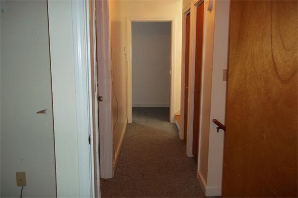 34 Farmland Road, Unit D Lowell, MA 01850 - Photo 9 of 10 a view of a hallway with wooden floor