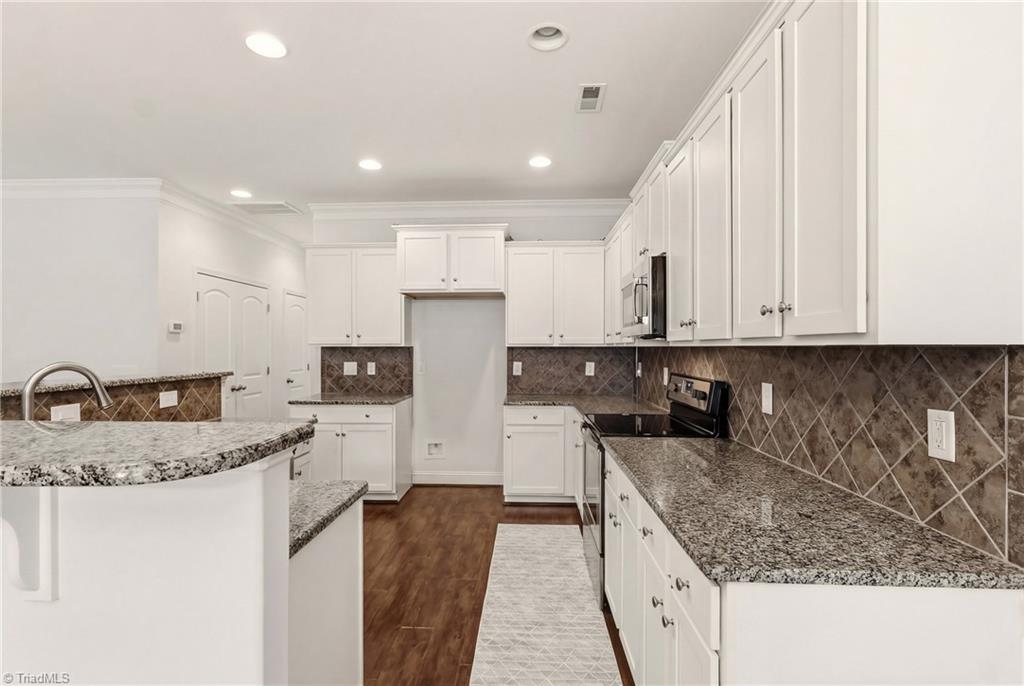 3518 Pebblestone Lane High Point, NC 27265 - Photo 14 of 50 Granite countertops and tile backsplash