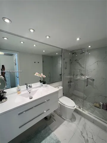 a bathroom with a shower and a toilet