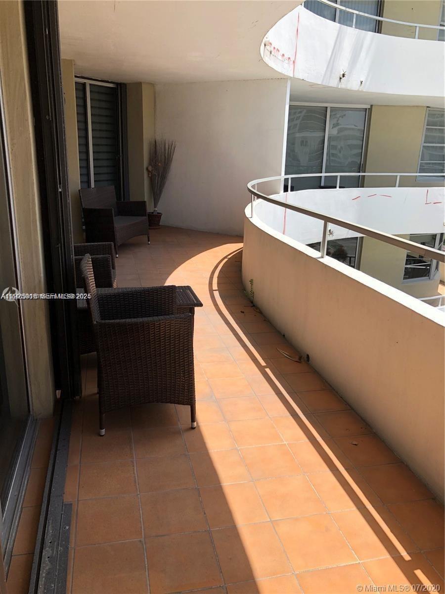 5555 Collins Avenue, Unit 7T Miami Beach, FL 33140 - Photo 5 of 19 a view of outdoor space with seating