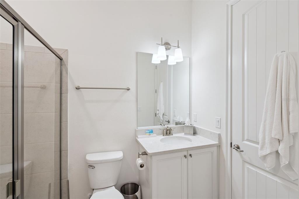 8082 Knee Deep Road Kissimmee, FL 34747 - Photo 13 of 30 a bathroom with a sink toilet and shower