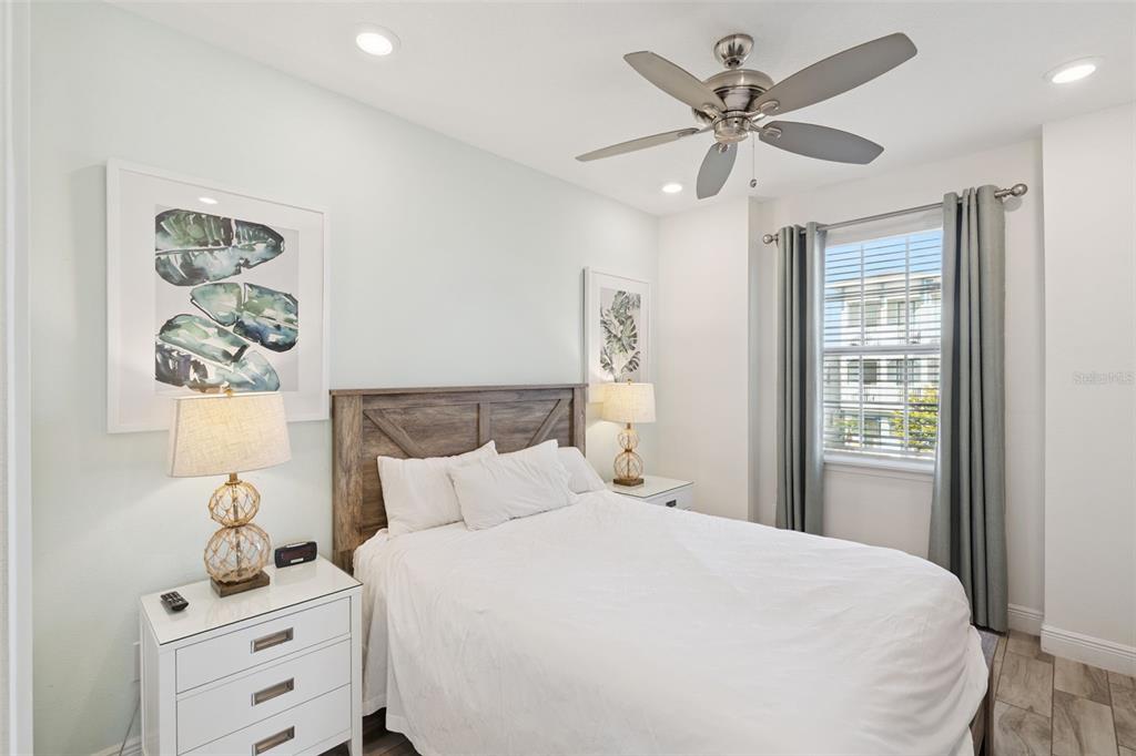 8082 Knee Deep Road Kissimmee, FL 34747 - Photo 14 of 30 a bedroom with a bed and a window