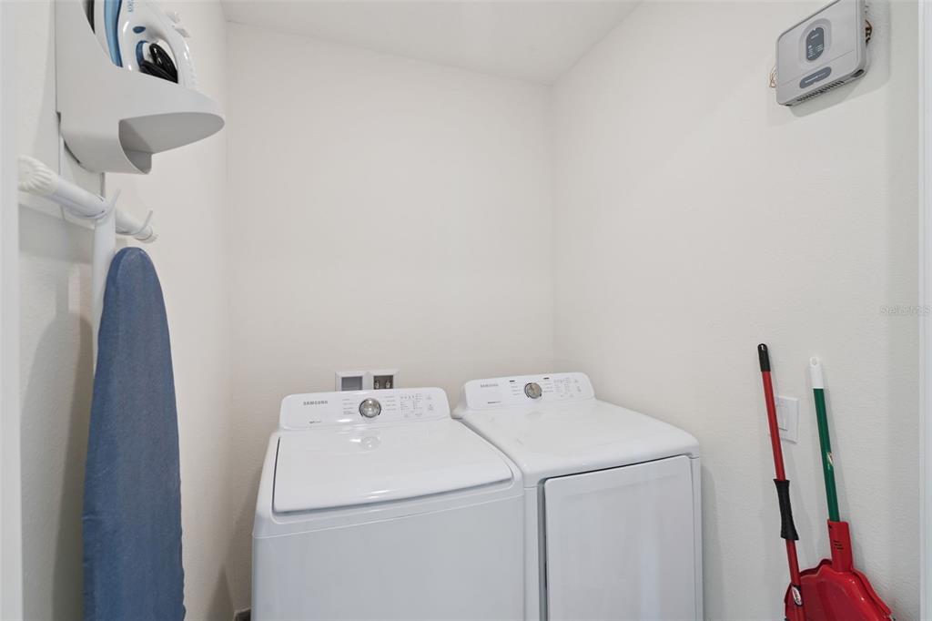 8082 Knee Deep Road Kissimmee, FL 34747 - Photo 21 of 30 a utility room with dryer and washer