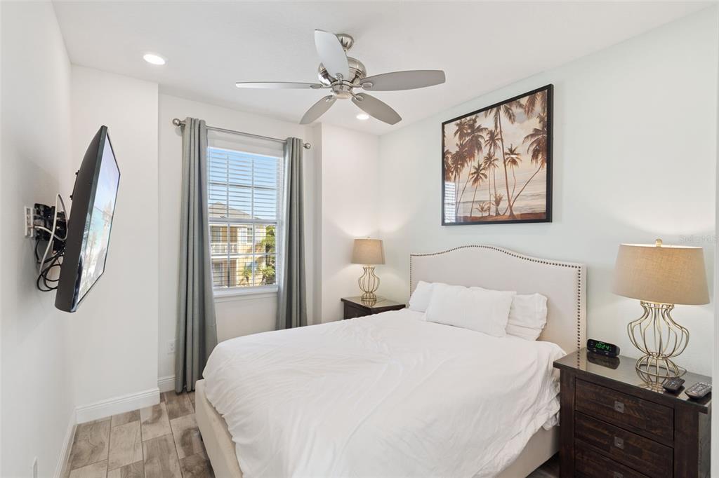 8082 Knee Deep Road Kissimmee, FL 34747 - Photo 24 of 30 a bedroom with a large bed and a window