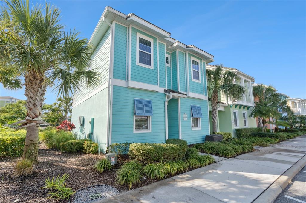 8082 Knee Deep Road Kissimmee, FL 34747 - Photo 26 of 30 a front view of a house with a garden