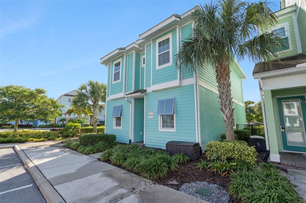 8082 Knee Deep Road Kissimmee, FL 34747 - Photo 30 of 30 a front view of a house with a yard and potted plants