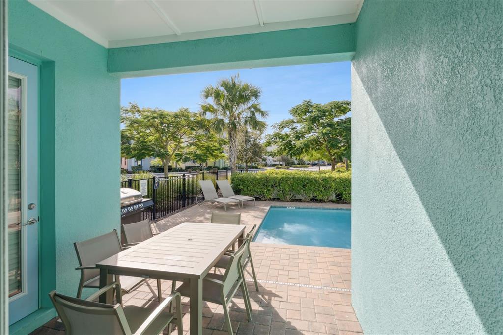8082 Knee Deep Road Kissimmee, FL 34747 - Photo 9 of 30 a view of a chairs and table in patio
