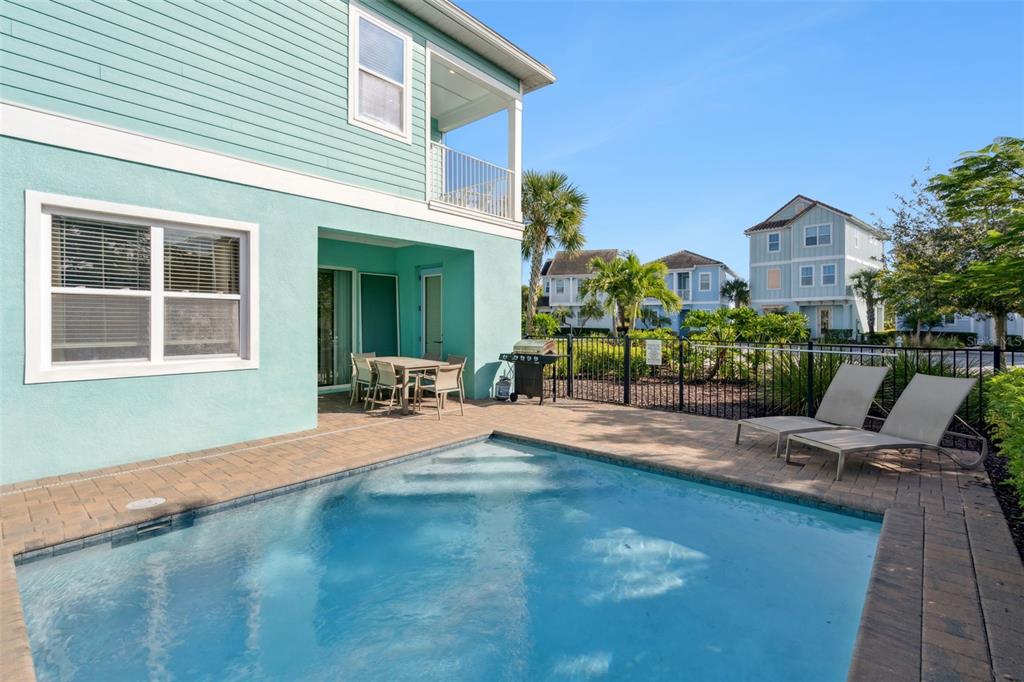 8082 Knee Deep Road Kissimmee, FL 34747 - Photo 10 of 30 a view of a house with backyard porch and sitting area
