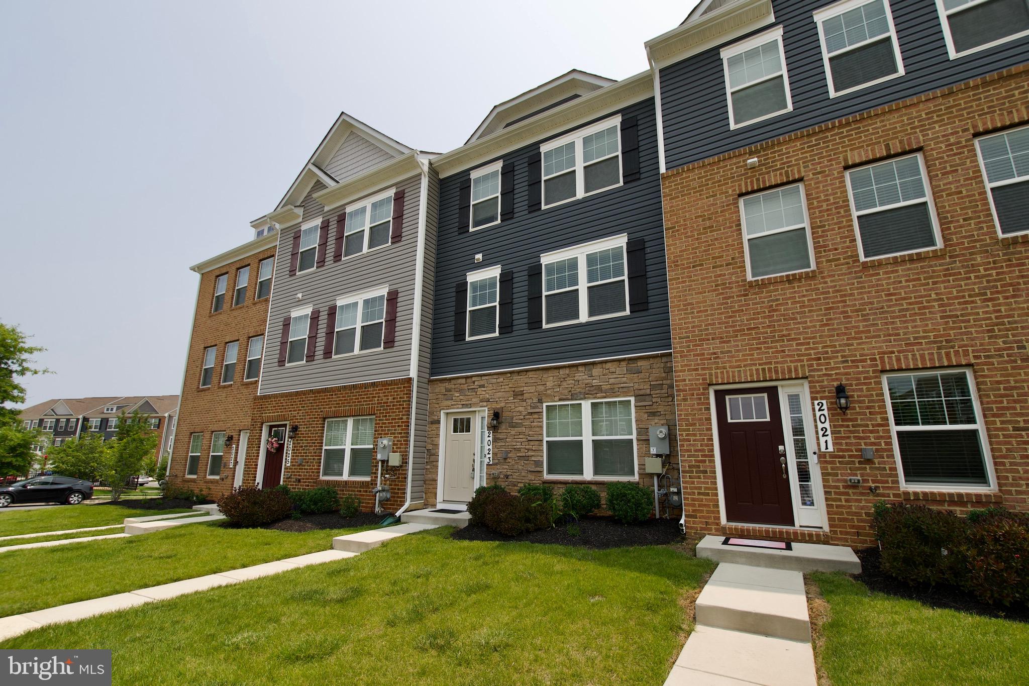 2023 Cross Church Way Bowie, MD 20721 - Photo 1 of 30 a front view of a building with a yard