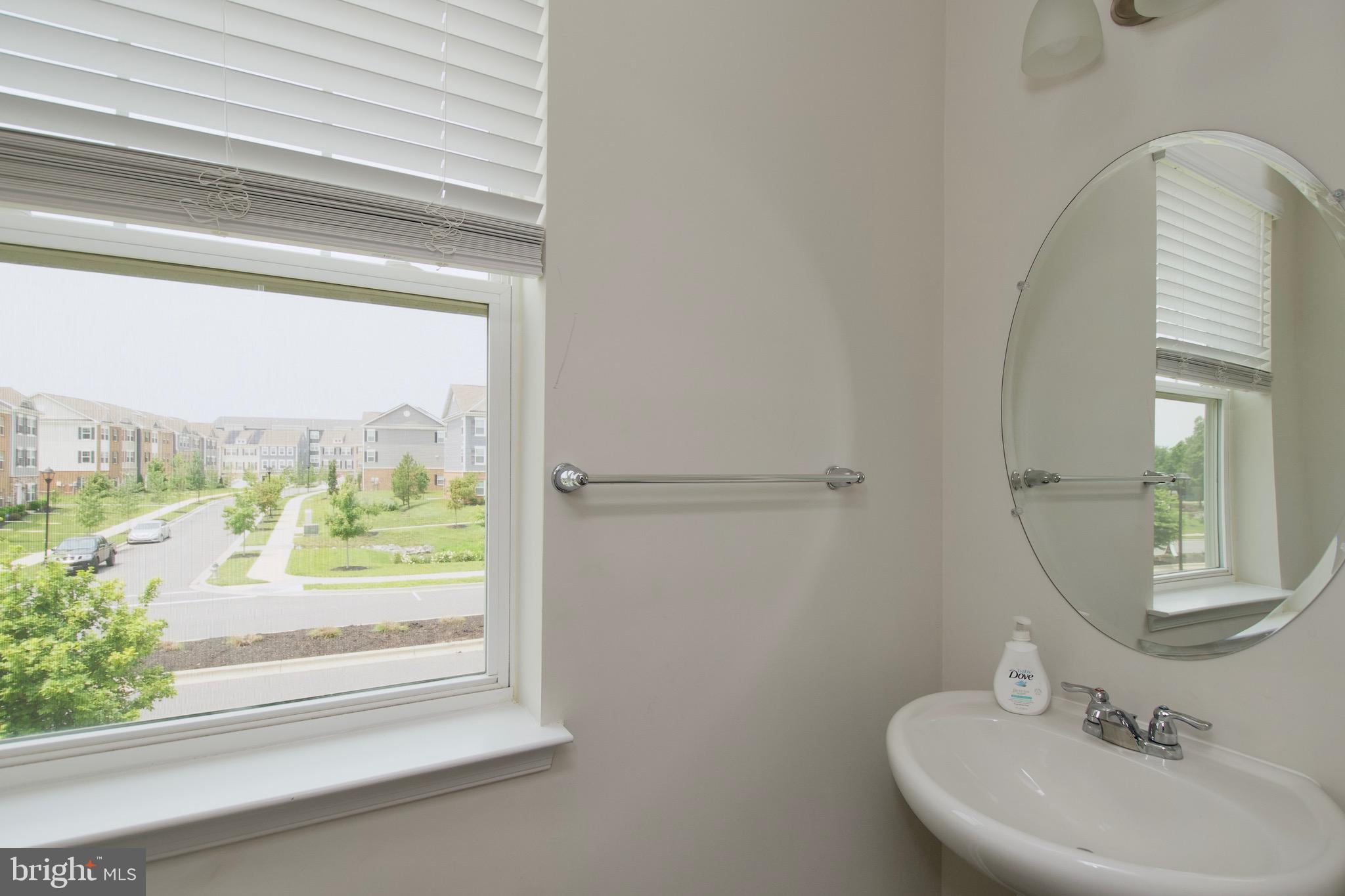 2023 Cross Church Way Bowie, MD 20721 - Photo 17 of 30 a bathroom with a sink and a mirror