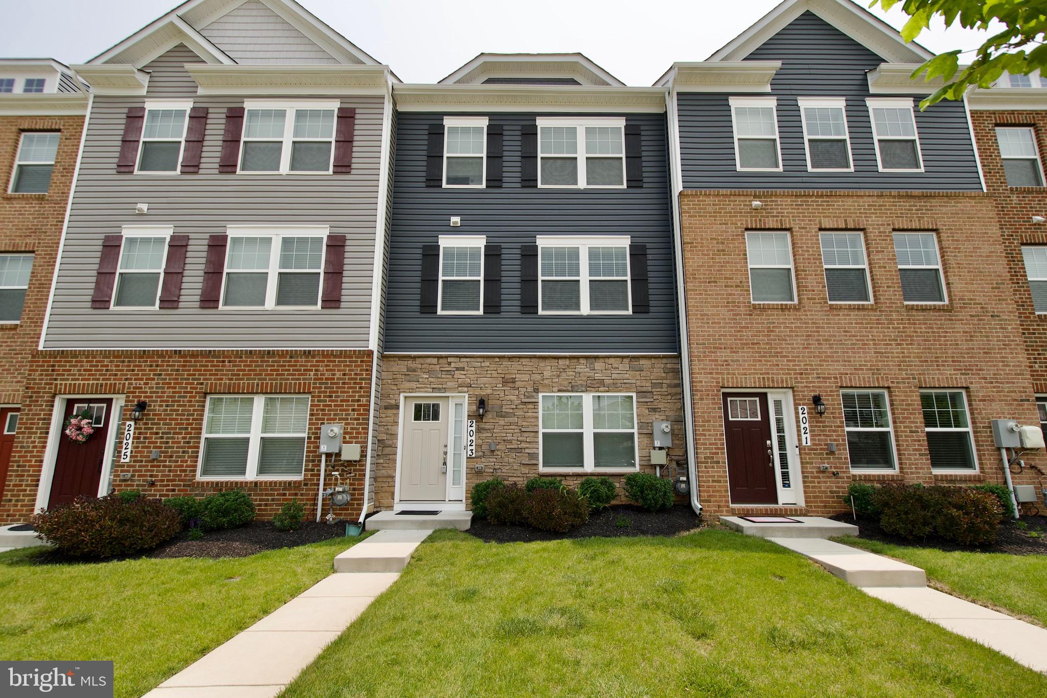 2023 Cross Church Way Bowie, MD 20721 - Photo 2 of 30 a front view of a brick house with a yard