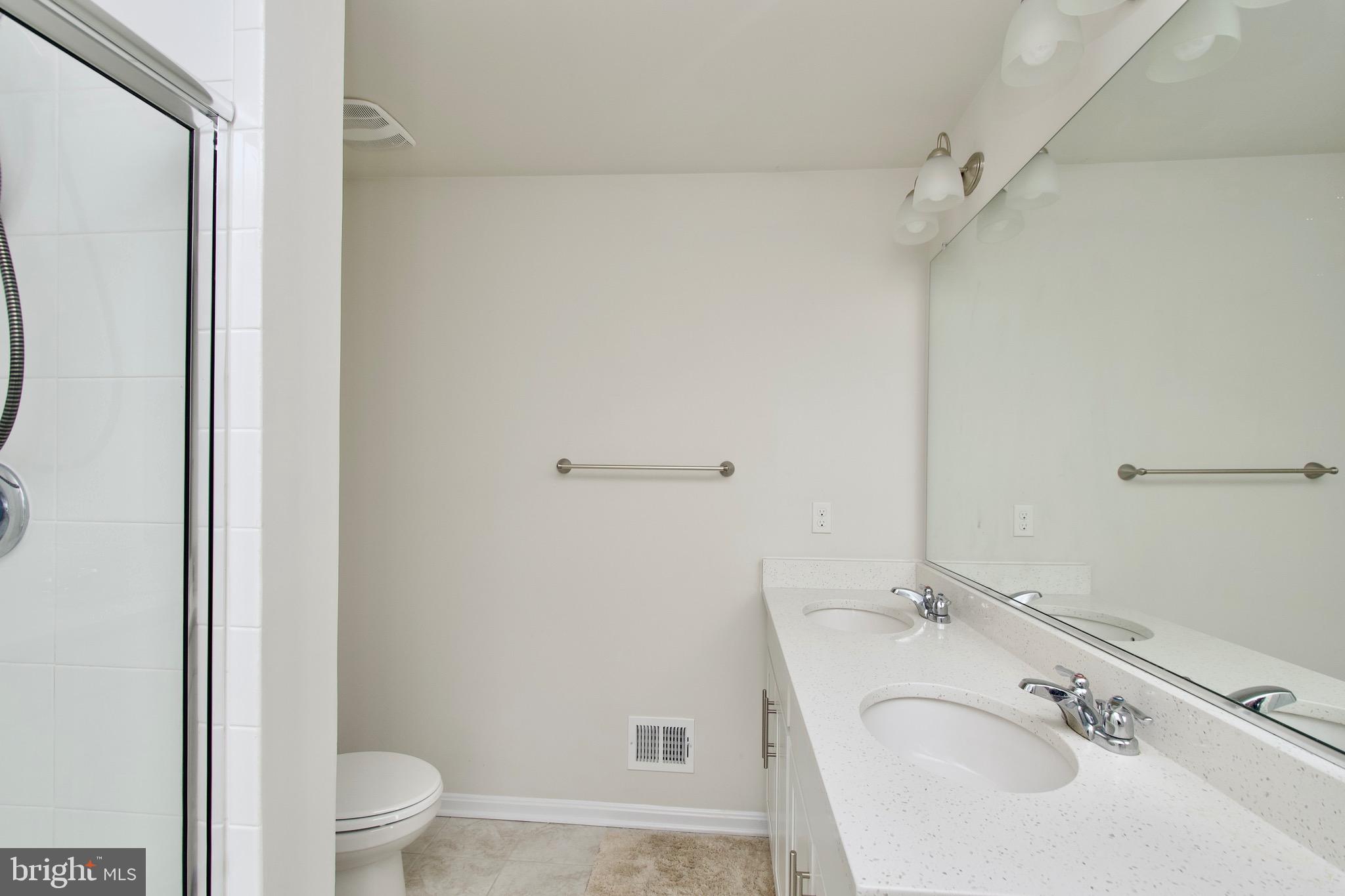 2023 Cross Church Way Bowie, MD 20721 - Photo 27 of 30 a bathroom with a sink toilet and shower