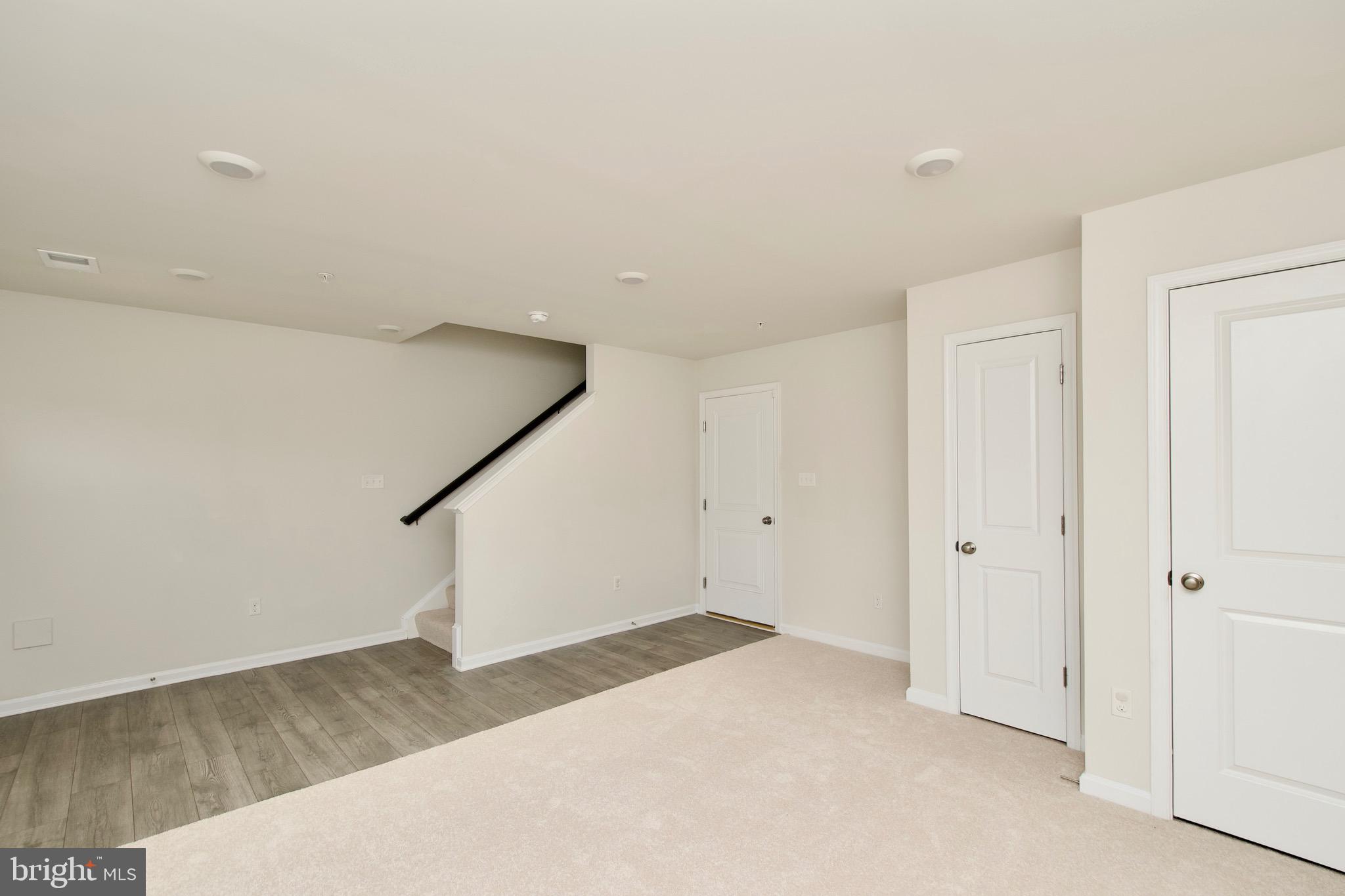 2023 Cross Church Way Bowie, MD 20721 - Photo 6 of 30 a view of a room with stairs and wooden floor