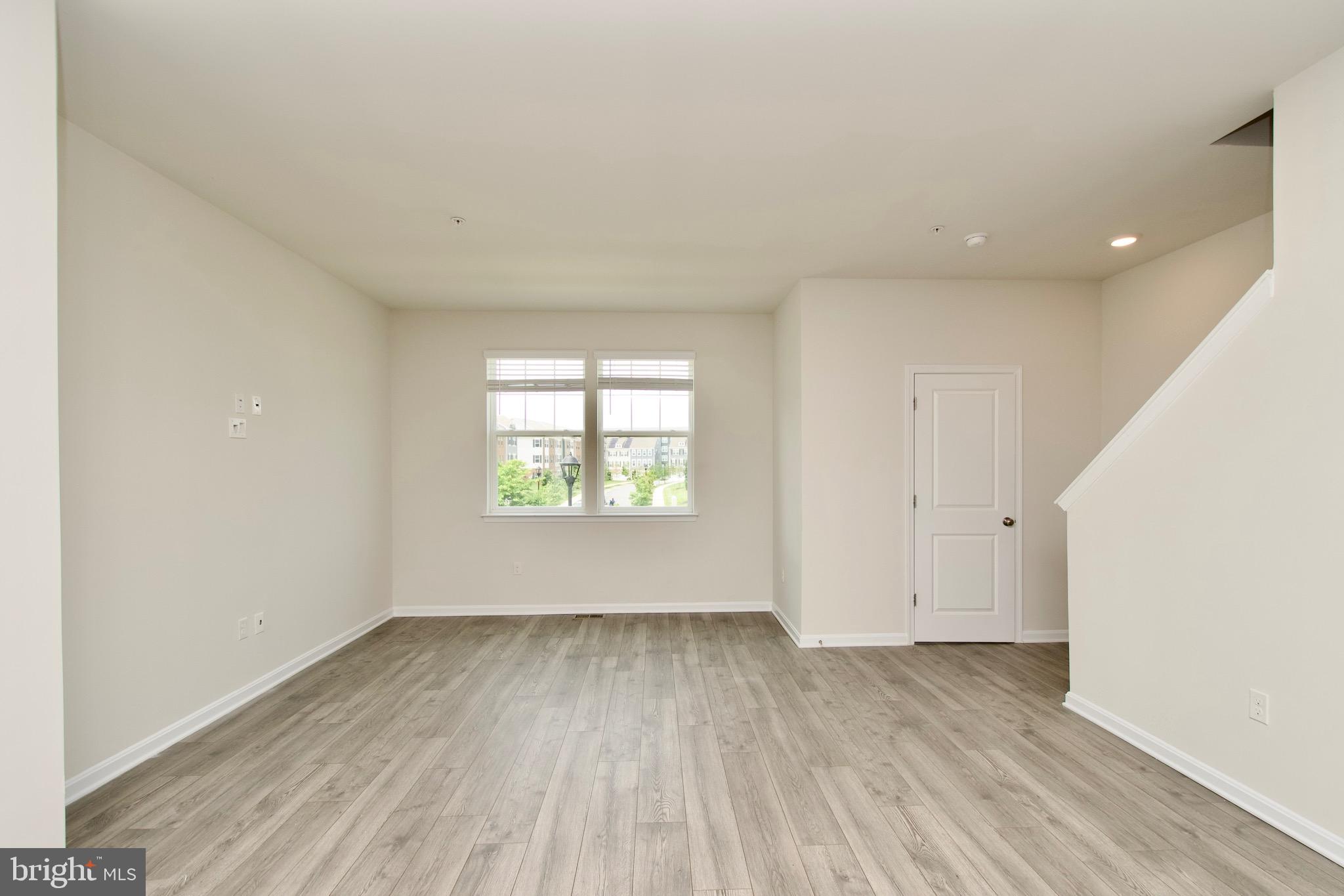 2023 Cross Church Way Bowie, MD 20721 - Photo 7 of 30 an empty room with wooden floor and windows