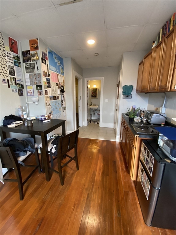 868 Beacon Street, Unit 14 Boston, MA 02215 - Photo 2 of 5 a living room with furniture and wooden floor