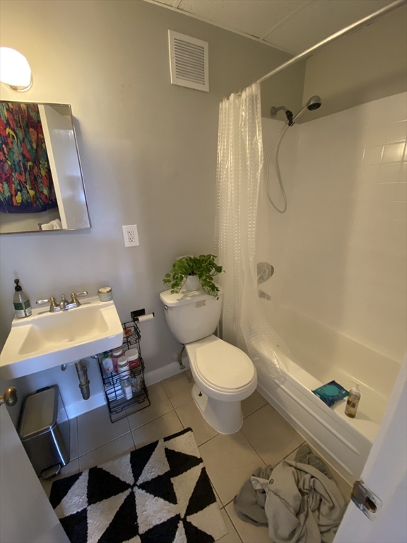 868 Beacon Street, Unit 14 Boston, MA 02215 - Photo 5 of 5 a bathroom with a sink toilet and shower