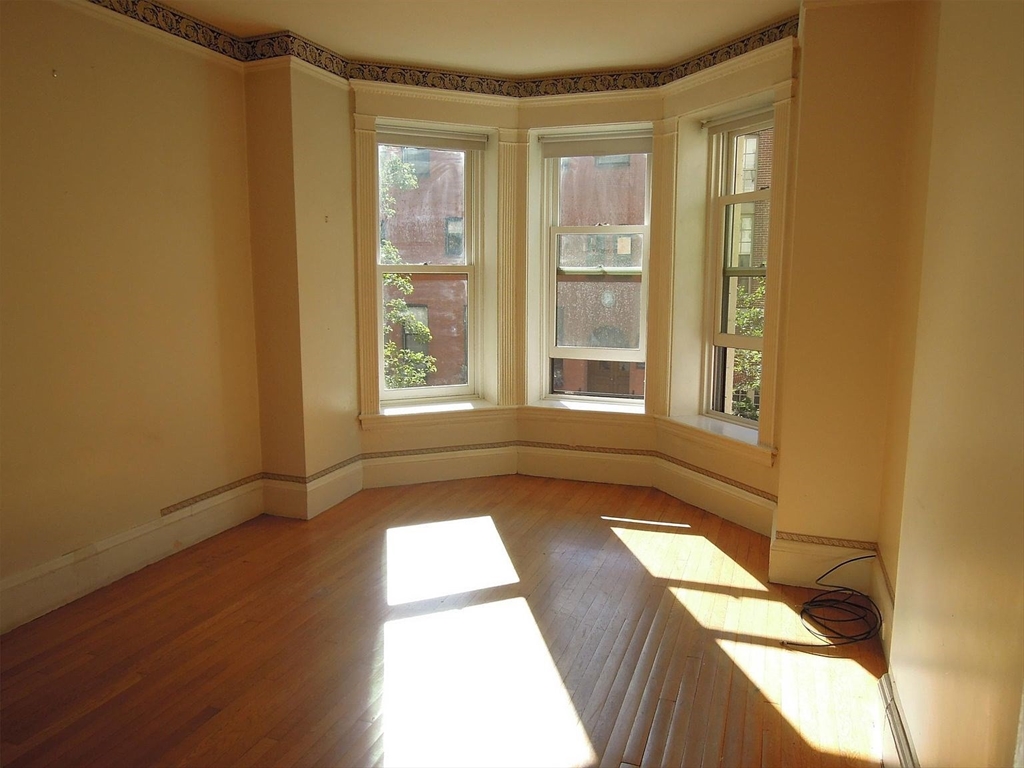8 Garrison Street, Unit 209 Boston, MA 02116 - Photo 7 of 33 a view of an empty room and window