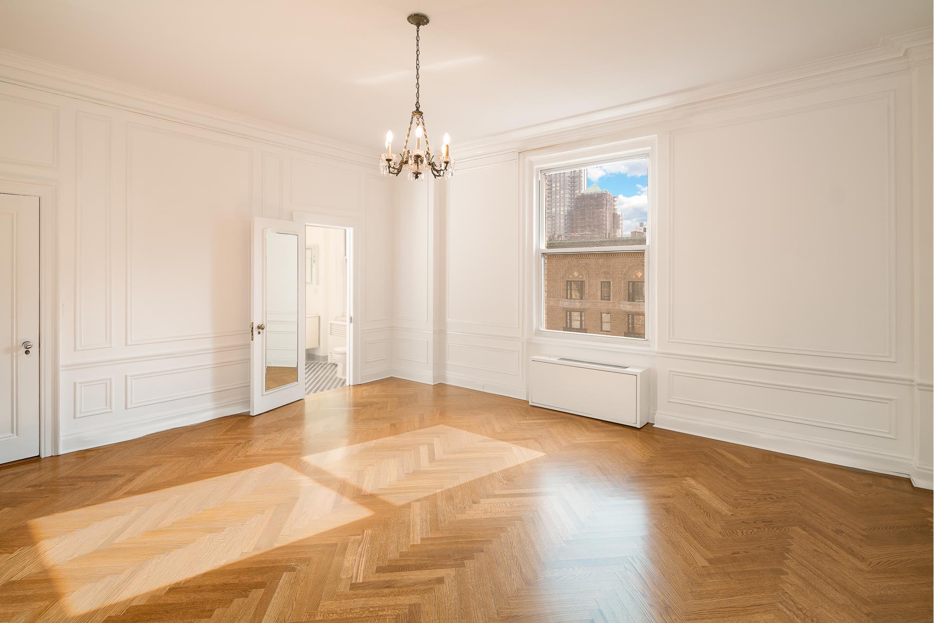 550 Park Avenue, Unit 12E Manhattan, NY 10065 - Photo 18 of 29 a view of an empty room with a window