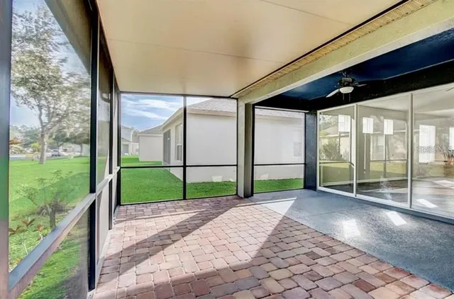a view of a porch with wooden floor and fence