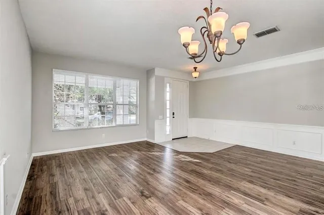 a view of a livingroom with wooden floor