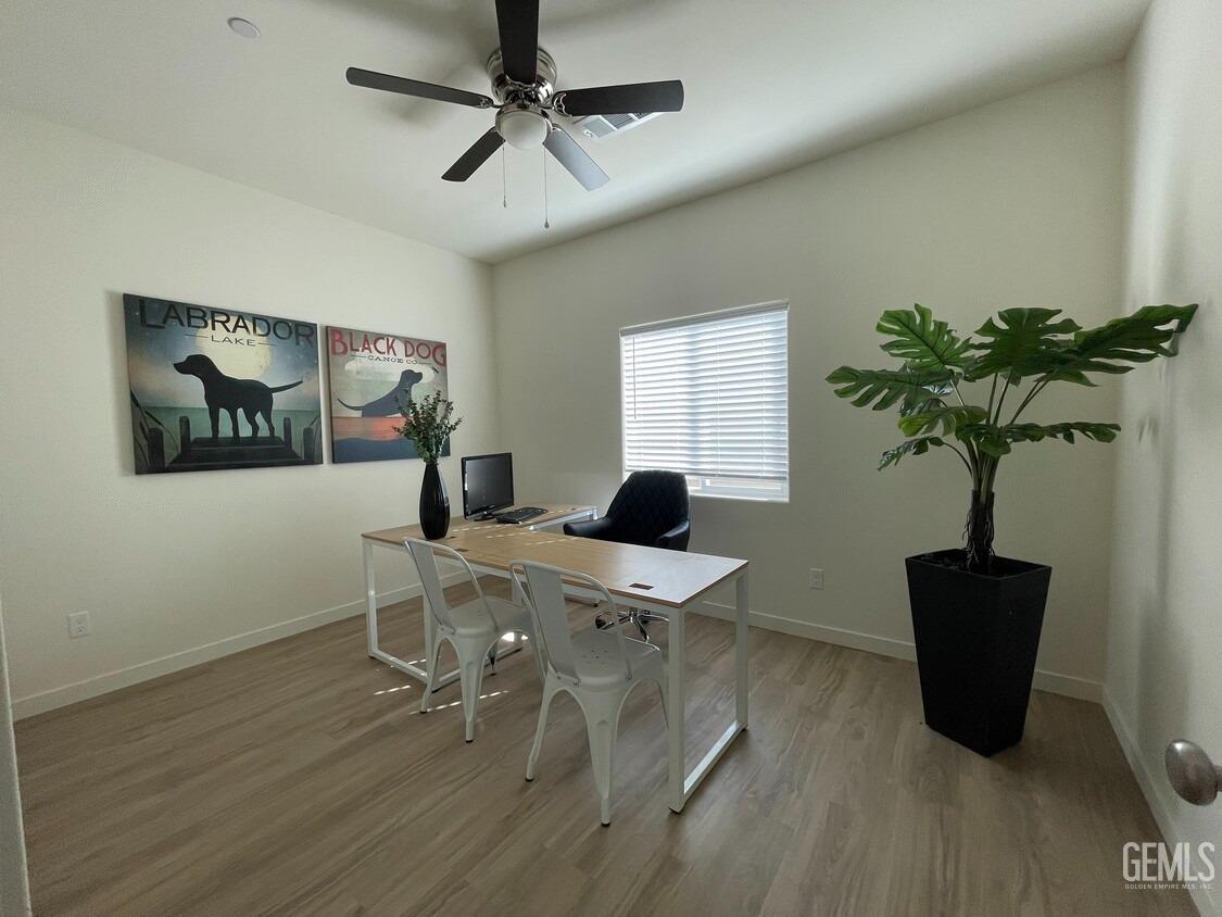 Undisclosed Address Bakersfield, CA 93314 - Photo 12 of 12 a workspace with furniture window and wooden floor