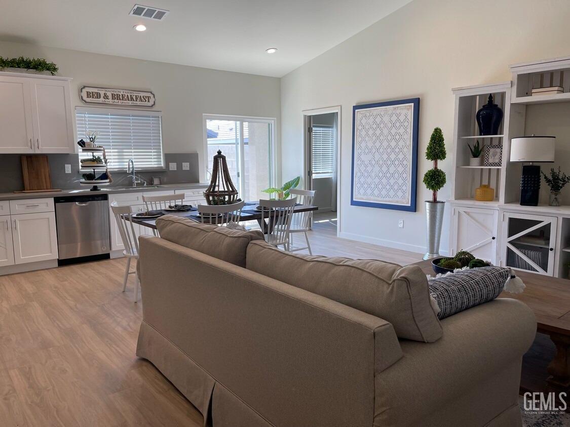 Undisclosed Address Bakersfield, CA 93314 - Photo 4 of 12 a living room with furniture and a wooden floor
