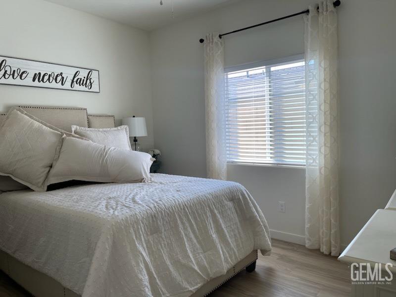 Undisclosed Address Bakersfield, CA 93314 - Photo 8 of 12 a bedroom with a bed and a window