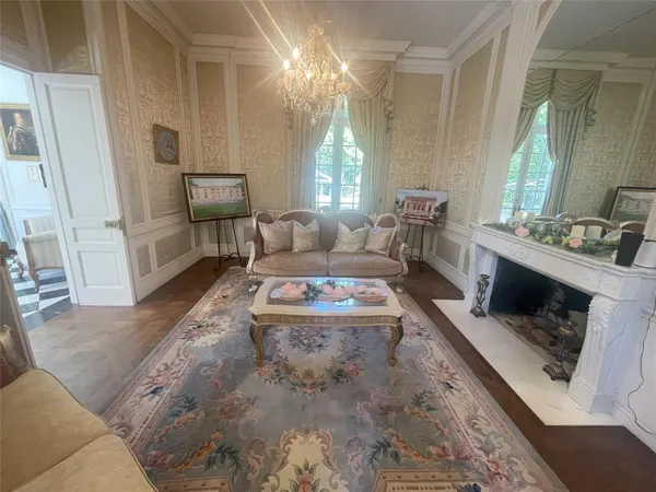a view of a livingroom with furniture window and wooden floor