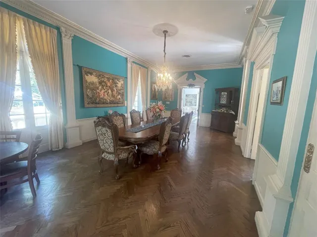 a large kitchen with stainless steel appliances a stove a sink and a refrigerator