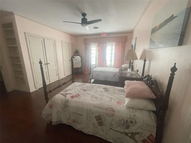 a living room with couches and chandelier
