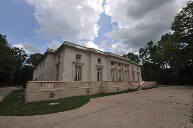 a view of a white building among the street side