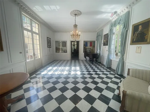a very nice looking open space with a black and white checkered floor