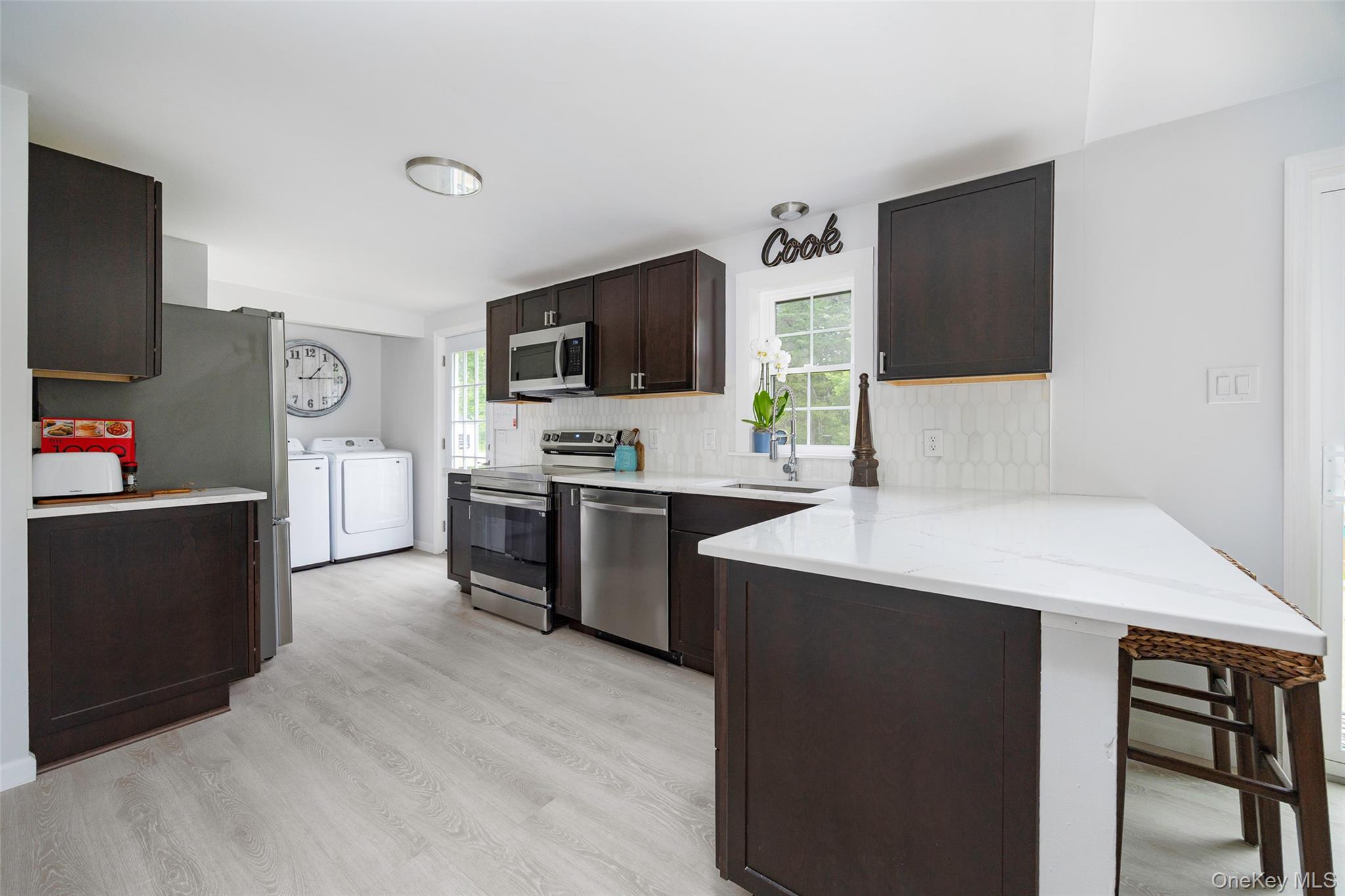 47 Clay Hill Road Tivoli, NY 12583 - Photo 11 of 43 a kitchen with cabinets and flat screen tv