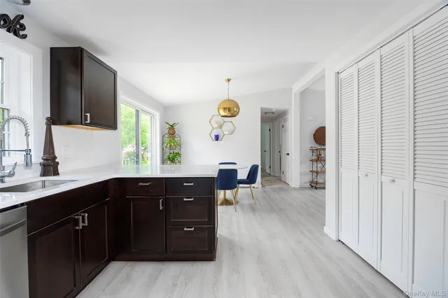 a spacious bathroom with a sink and a mirror