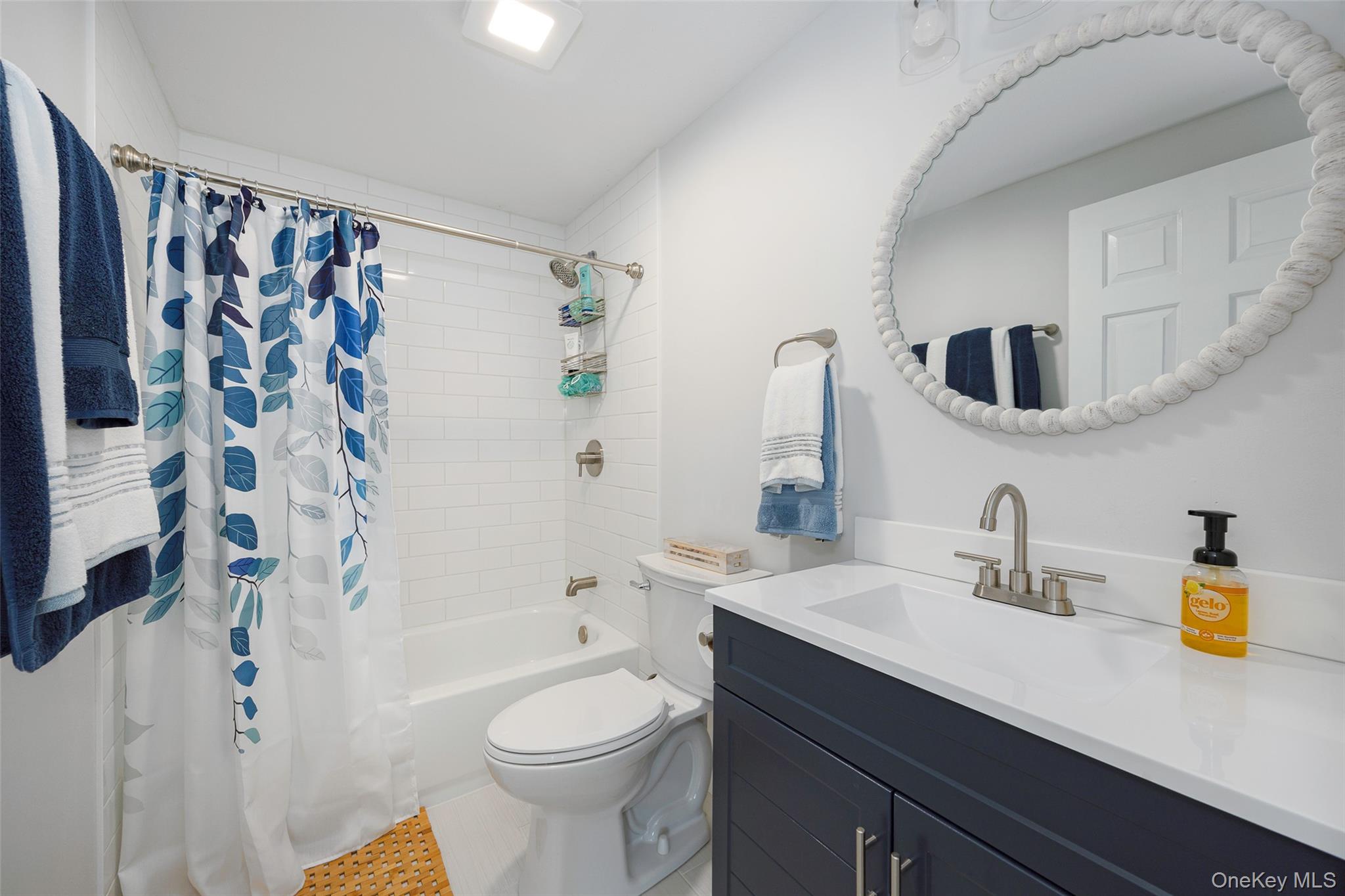 47 Clay Hill Road Tivoli, NY 12583 - Photo 21 of 43 a bathroom with a sink a toilet and shower curtain