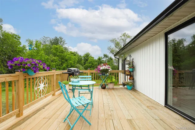 a view of balcony with wooden floor