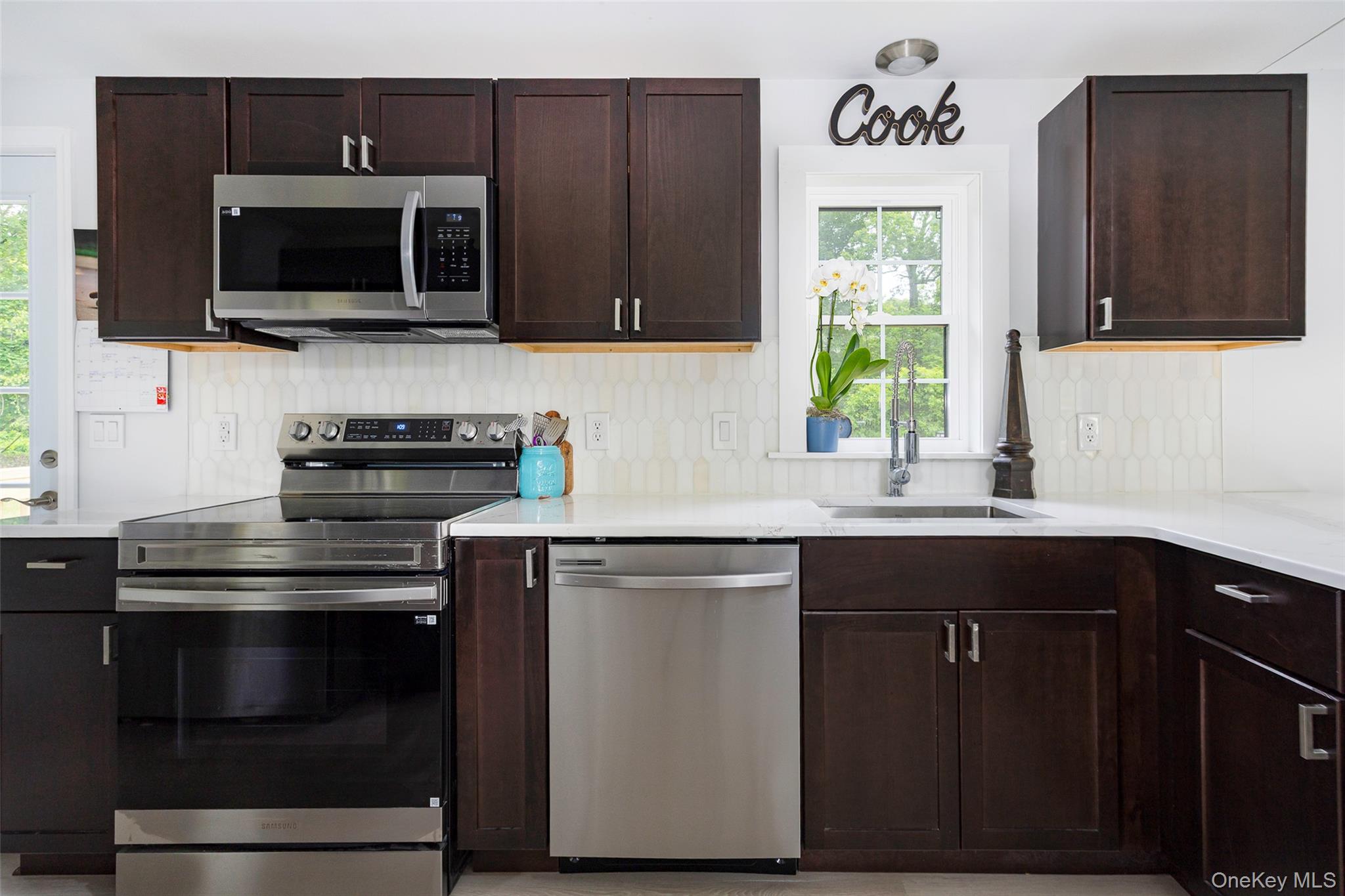 47 Clay Hill Road Tivoli, NY 12583 - Photo 9 of 43 a kitchen with stainless steel appliances a stove microwave and sink