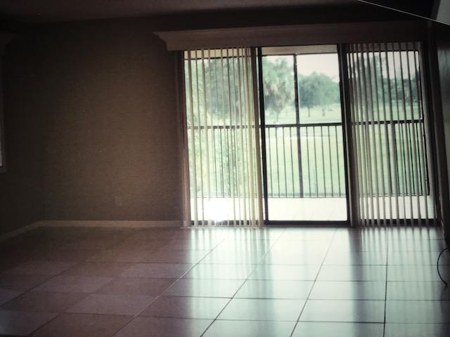 1400 Northwest 45th Street, Unit B5 Pompano Beach, FL 33064 - Photo 3 of 9 a view of an empty room and balcony