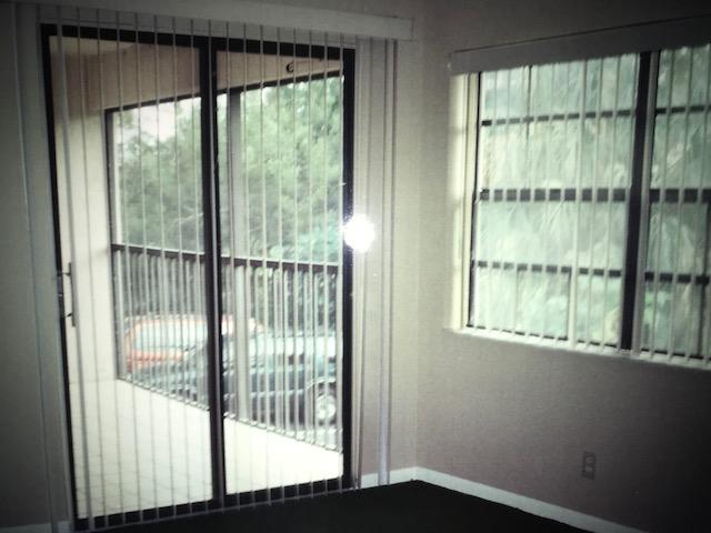 1400 Northwest 45th Street, Unit B5 Pompano Beach, FL 33064 - Photo 9 of 9 a view of a room that has a bed and a window