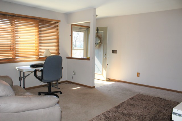 148 Fernwood Road Montgomery, IL 60538 - Photo 3 of 19 a view of a workspace with furniture and a window
