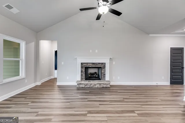 a view of backyard with a plants and trees