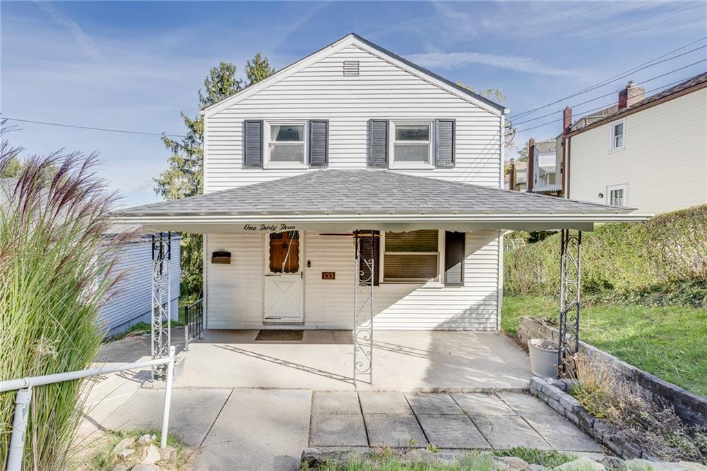 133 Hamburg Street Pittsburgh, PA 15220 - Photo 2 of 41 a front view of a house with a yard
