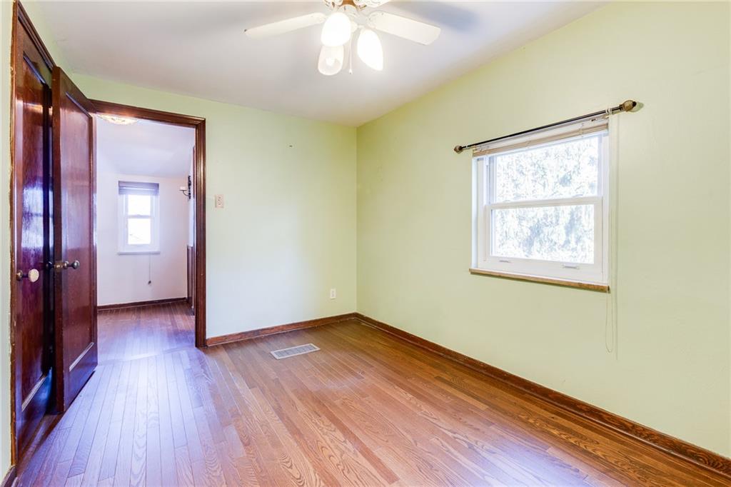 133 Hamburg Street Pittsburgh, PA 15220 - Photo 23 of 41 wooden floor in an empty room with a window