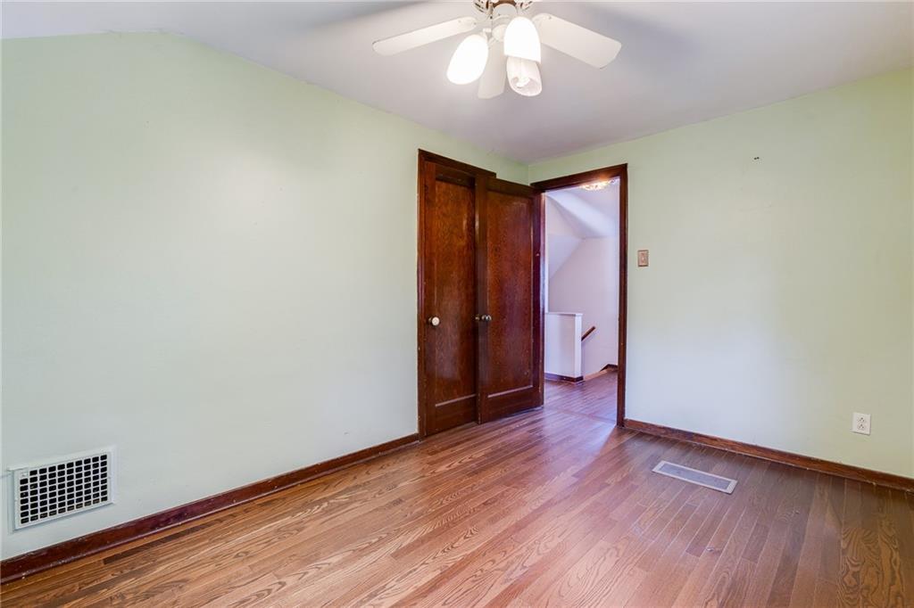 133 Hamburg Street Pittsburgh, PA 15220 - Photo 24 of 41 a view of an empty room with wooden floor