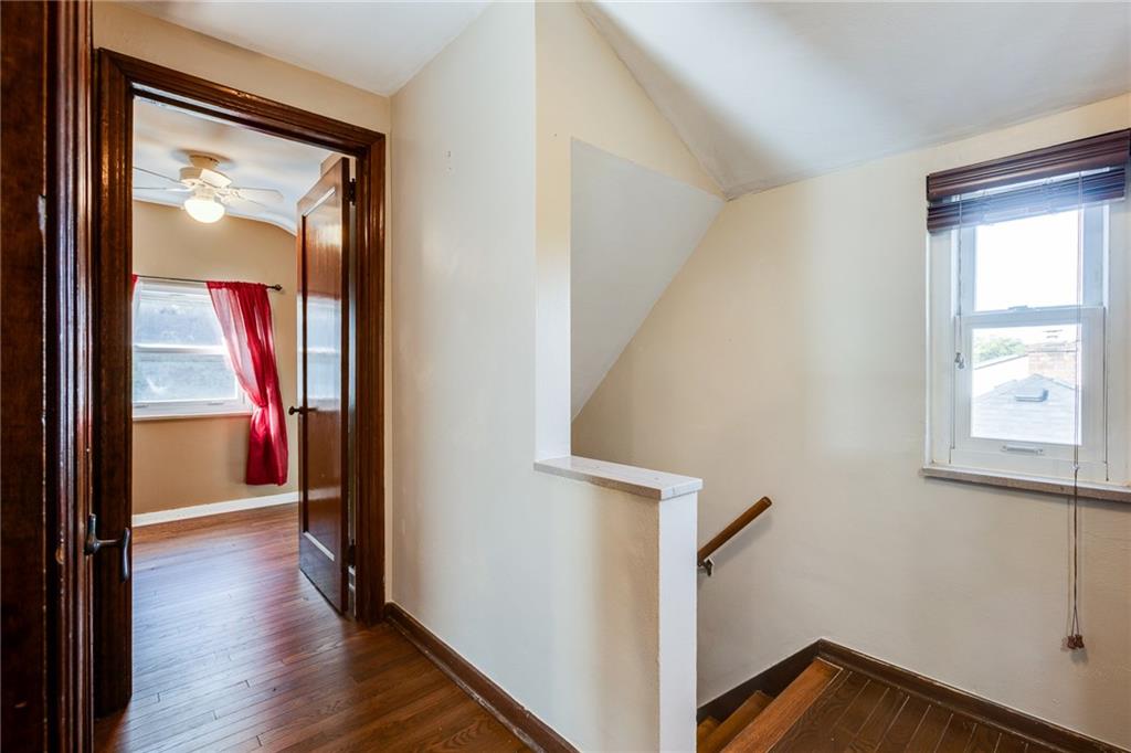 133 Hamburg Street Pittsburgh, PA 15220 - Photo 26 of 41 a view of a hallway view with wooden floor and staircase