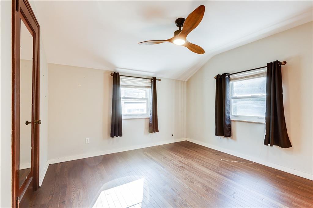 133 Hamburg Street Pittsburgh, PA 15220 - Photo 27 of 41 wooden floor in an empty room with a window