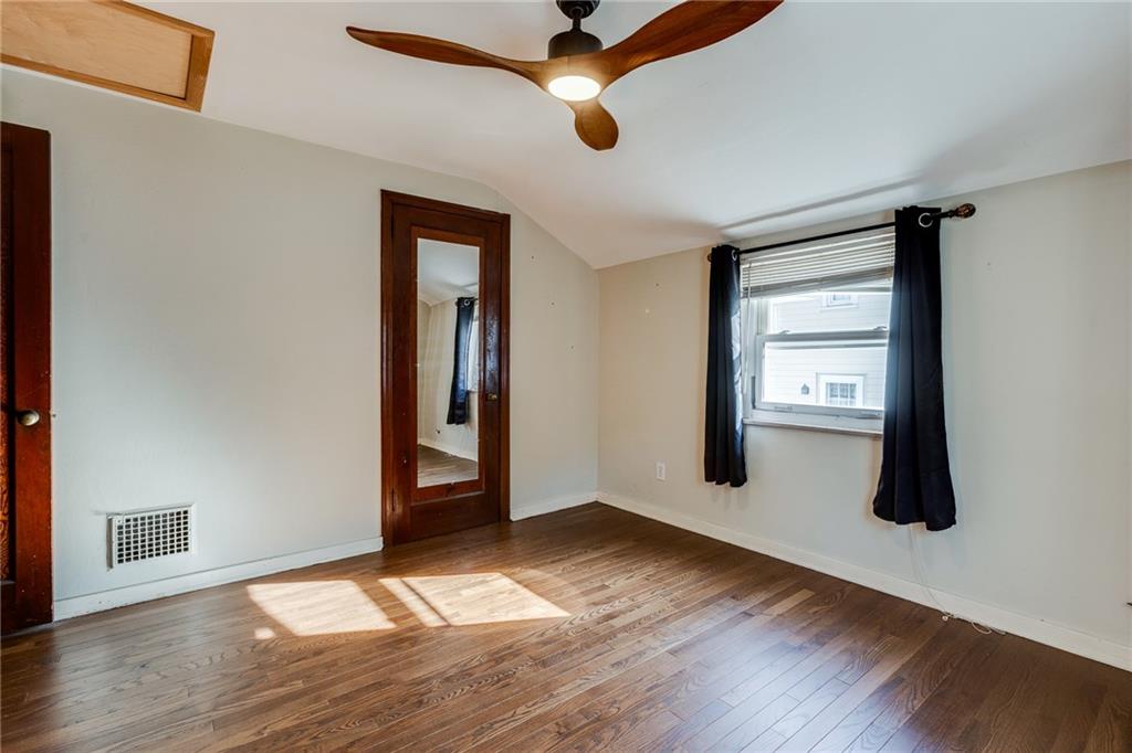 133 Hamburg Street Pittsburgh, PA 15220 - Photo 28 of 41 a view of empty room with wooden floor and fan